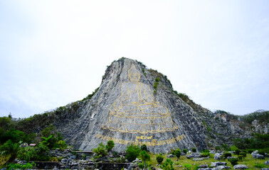 The Buddha Mountain (Khao Chi Chan), Thailand. A large image of the Buddha on the mountain.