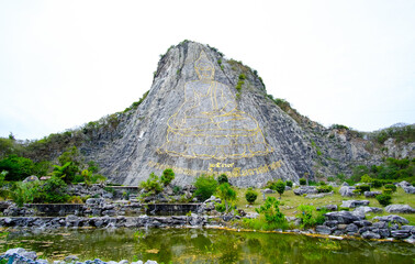 The Buddha Mountain (Khao Chi Chan), Thailand. A large image of the Buddha on the mountain.