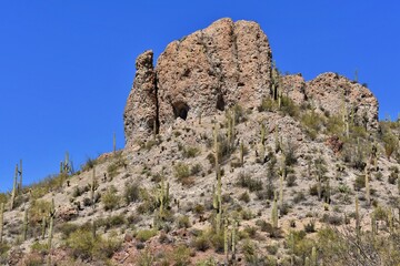 Fototapeta na wymiar A large rock formation high on a hill in the Arizona desert.