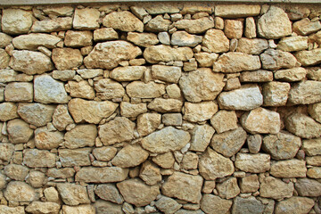 Stone background texture of a wall from The Palace of Knossos on Crete in Greece near Heraklion is called Europe’s oldest city and the ceremonial and political center of the Minoan civilization.  