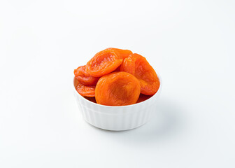 Sweet dried apricots on a white background. Healthy snacks.