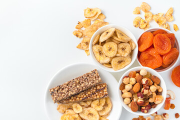 Assortment of nuts, dried fruits and granola bar. Healthy dessert, natural snacks.