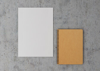 Mockup craft notebook with spring and white paper. Mockup brown notebook with spring near a sheet of paper on a gray background. 3D concept. 3D illustration