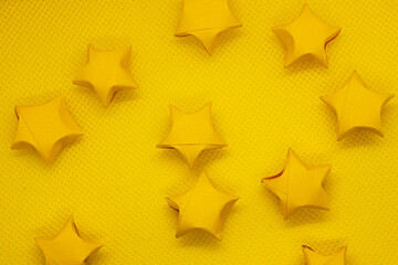 paper stars on yellow background