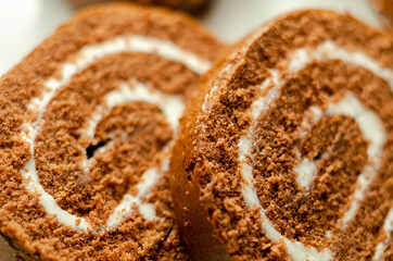Chocolate sponge roll with a vanilla flavour filling, chocolate swiss roll