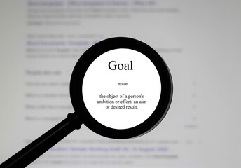 The word goal, word in a dictionary. Close up of an English dictionary page with word goal.