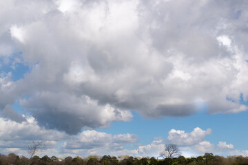 White and gray clouds in the blue sky .
