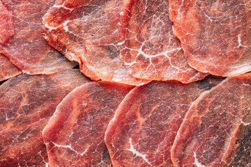 Sliced carpaccio. Raw beef meat.
