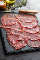 Sliced carpaccio. Raw beef meat.