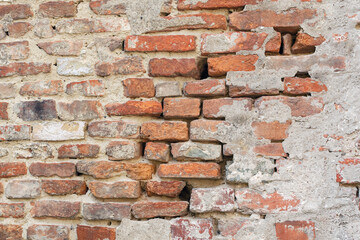 a background of old, dilapidated orange bricks