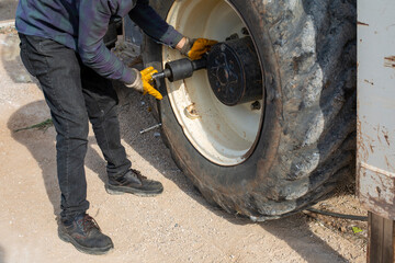 Repairing the tire of a large construction machine