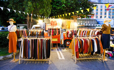 An open-air clothing store. Sale of clothing in the old school style