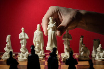business chess strategy concept. person holding chess figure to make choice. creative leadership conceptual