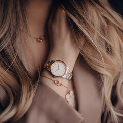 Beautiful white golden watch on woman hand - obrazy, fototapety, plakaty