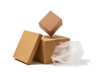Different shaped cardboard boxes and bubble wrap isolated on white background