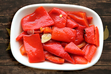 red peppers cooked in embers on the table