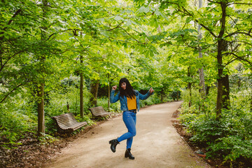 Fototapeta premium girl walks feeling happy nature moments