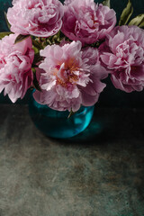 Background with pink peonies in vase