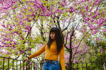 girl feeling nature smelling flowers 