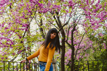 girl feeling nature smelling flowers 