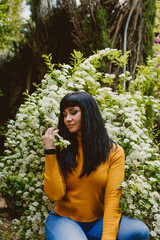 girl feeling nature smelling flowers 