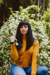 girl feeling nature smelling flowers