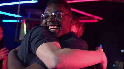 Two best friends from the esports team embrace at the award ceremony