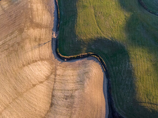 Details of a colorful countryside landscape with shadow and light in Tuscany.  Aerial view, drone shot.
