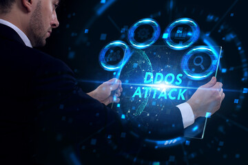 Business, Technology, Internet and network concept. Young businessman working on a virtual screen of the future and sees the inscription: Ddos attack