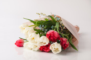 Bouquet of tulip flowers on white background. Flowers for celebration, congratulation.