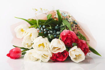 Bouquet of tulip flowers on white background. Flowers for celebration, congratulation.