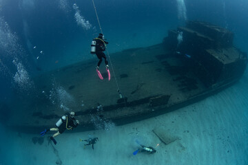 Divers on the wreck of the Carib Cargo off the island of Sint Maarten