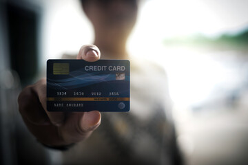 Young man holding credit card