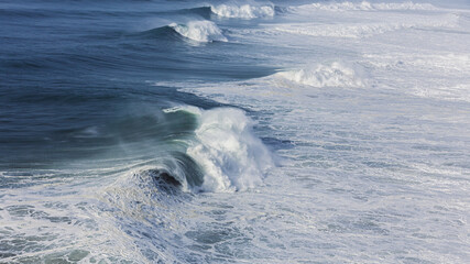 Fototapeta na wymiar Waves at the famous beach Praia do Norte ( North Beach )