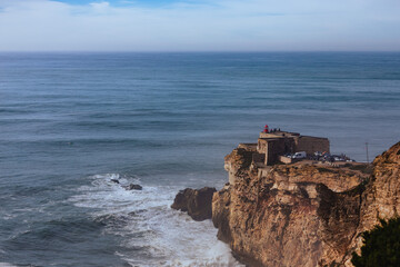 Fototapeta na wymiar View of the cliff and lighthouse in Nazaré