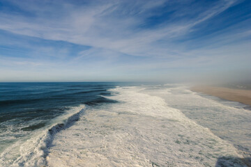 Waves at the famous beach Praia do Norte ( North Beach )