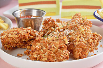 Yogurt oatmeal fried boneless chicken nuggets on a plate   