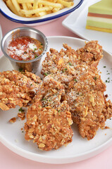 Yogurt oatmeal fried boneless chicken nuggets on a plate   
