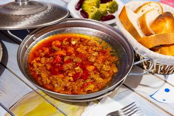 Traditional turkish et sote, meat saute with bread and vegetables