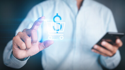 Businessman holding a cart and a dollar icon. The other hand uses a smartphone to represent online purchases. Concept Online shopping.