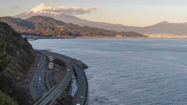 Timelapse of Mt Fuji, ocean and road from Satta Pass in Shizuoka, Japan