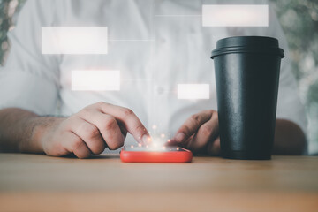 Young handsome man using smartphone with empty chart connection technology interface and a cup of hot coffee.