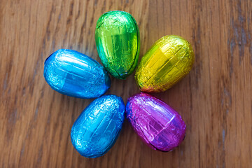a group of 5 colorful Easter chocolate eggs