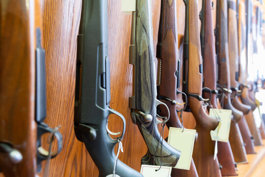 Gun store interior with specialized rifles on showcase