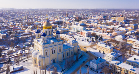 Naklejka premium Aerial view of Yelets winter cityscape and Orthodox Ascension Cathedral covered with snow, Russia