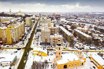 Obraz premium Scenic view from drone of snow covered modern Penza cityscape with two domed Orthodox Cathedral of Intercession, Russia..