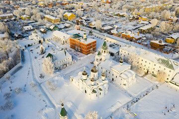 View from drone of Murom Transfiguration Monastery on background with cityscape on sunny winter day, Russia.