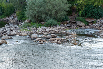 stones in the river near the dam. photo