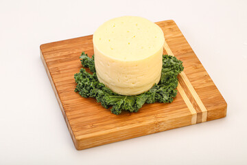 Yellow round dairy soft cheese