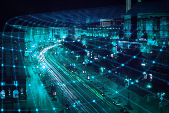 View of modern illuminated city at night. Concept of internet